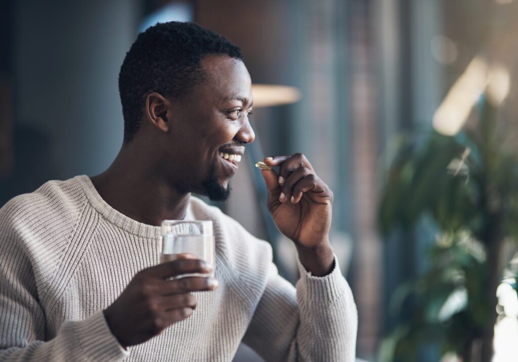 man taking vitamins