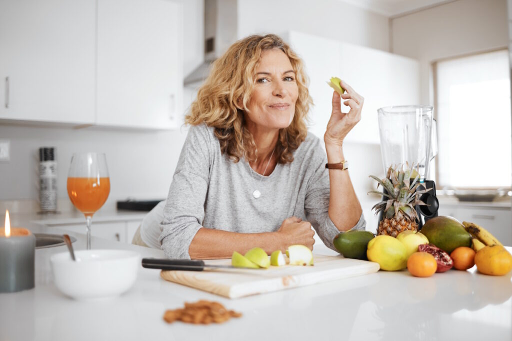 foot health woman preparing and eating fruit before making a smoothie
