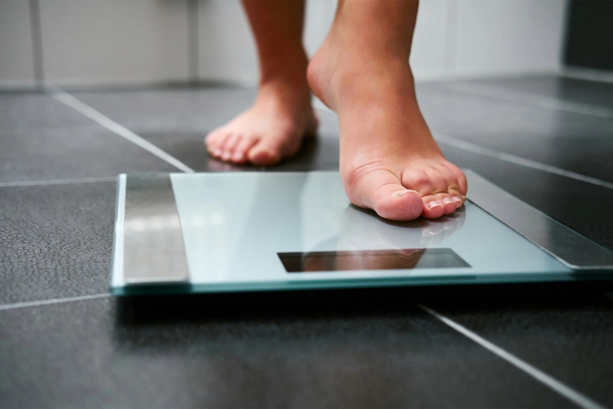 foot health woman weight scale